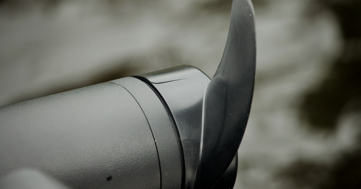 A close-up of a trolling motor propeller. The motor and propeller are both black, but only the propeller is glossy.